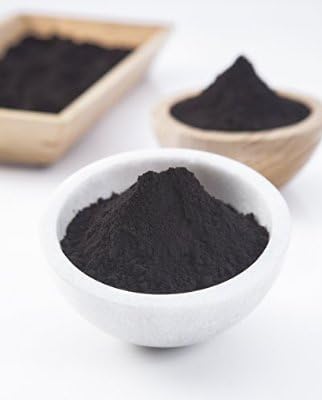 Authentic USA imported ultra fine activated charcoal powder being mixed for deep cleansing facial mask