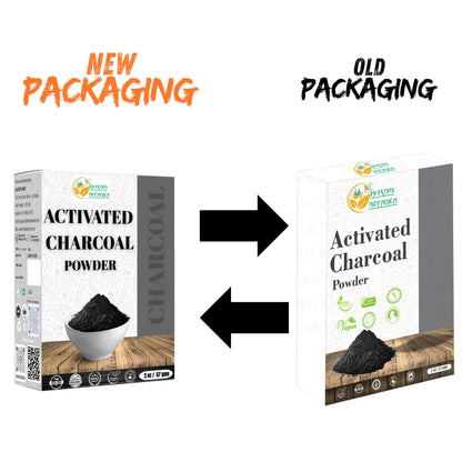 Scoop of fine black Herbs Botanica charcoal powder showcasing its smooth consistency