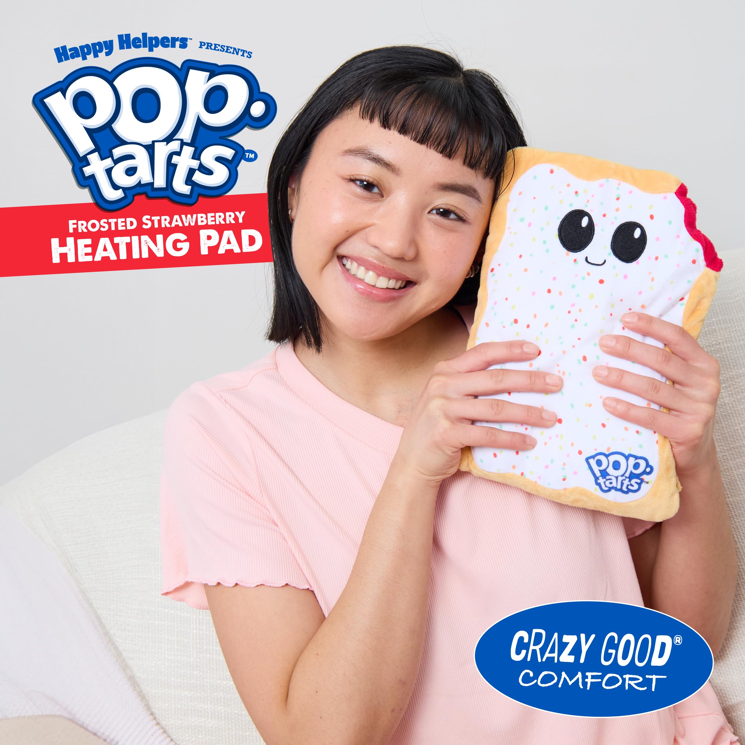 Frosted Strawberry Pop-Tarts heating pad held in hands