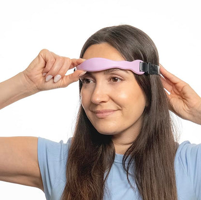 Flexible silicone material of the Headache Rescue strap being adjusted for universal head sizing.