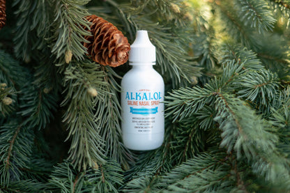 Alkalol refreshing saline wash bottle showing daily sinus care application instructions.