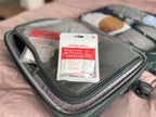 Roamwell Weekender portable medical pouch showing twelve in one symptom relief tablet selection.