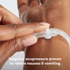 Frida Mom Anti-Nausea Bands demonstrating the internal acupressure button placement.