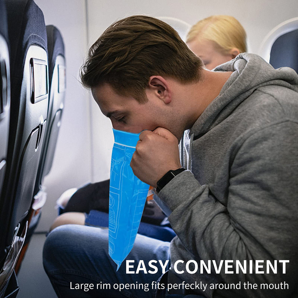 Cloudberg medical grade nausea bags folded compactly next to a travel backpack.