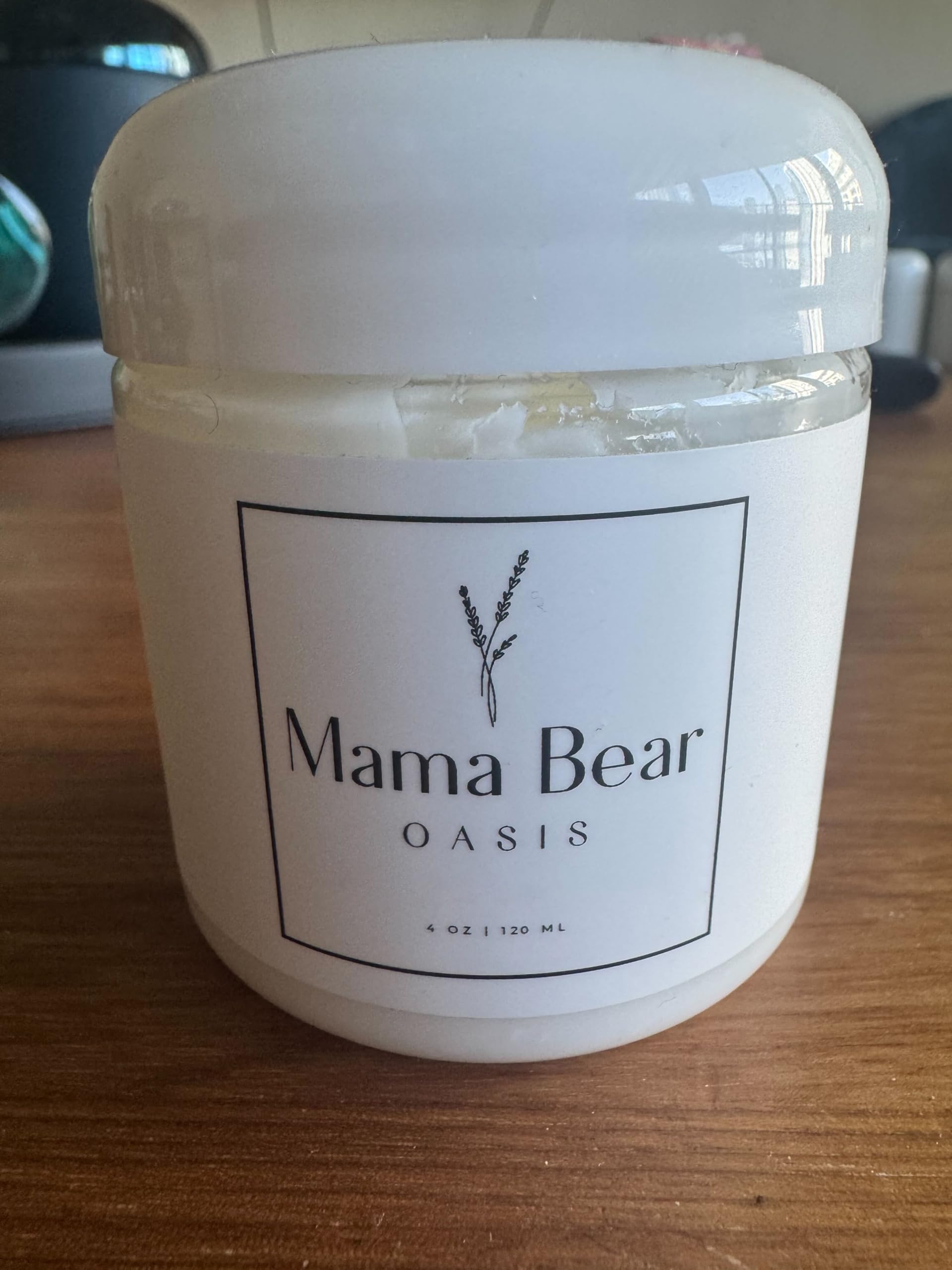 Mama Bear Oasis Magnesium Lotion showing the maximum strength ingredients label featuring arnica and aloe vera.