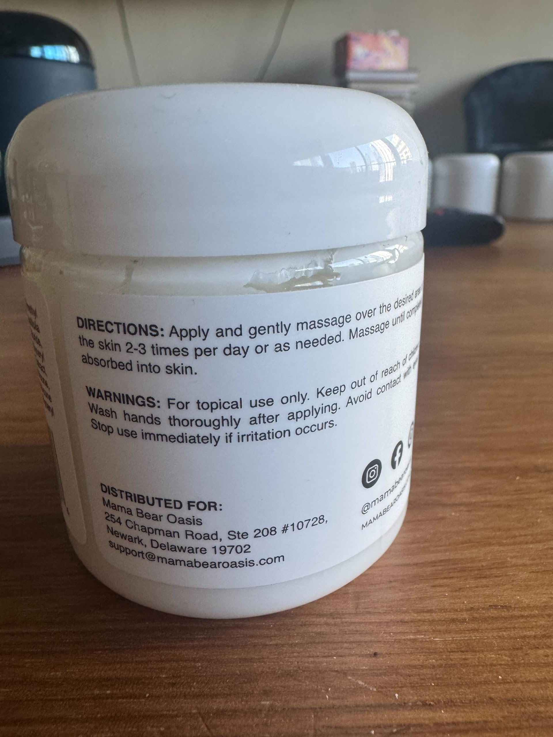 Mama Bear Oasis Nerve Relief Cream fast absorbing lightweight texture being applied onto a foot.