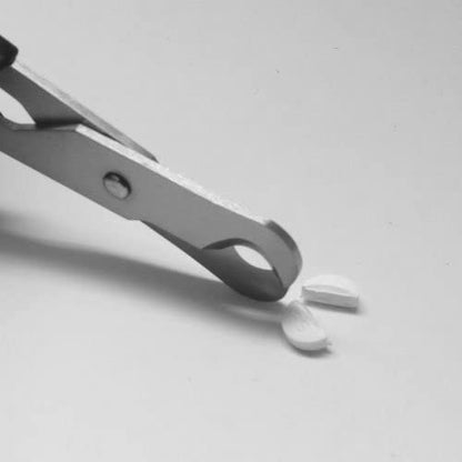 Japanese stainless steel pill cutter scissors packaging showing authentic manufacture details from Seki Japan.