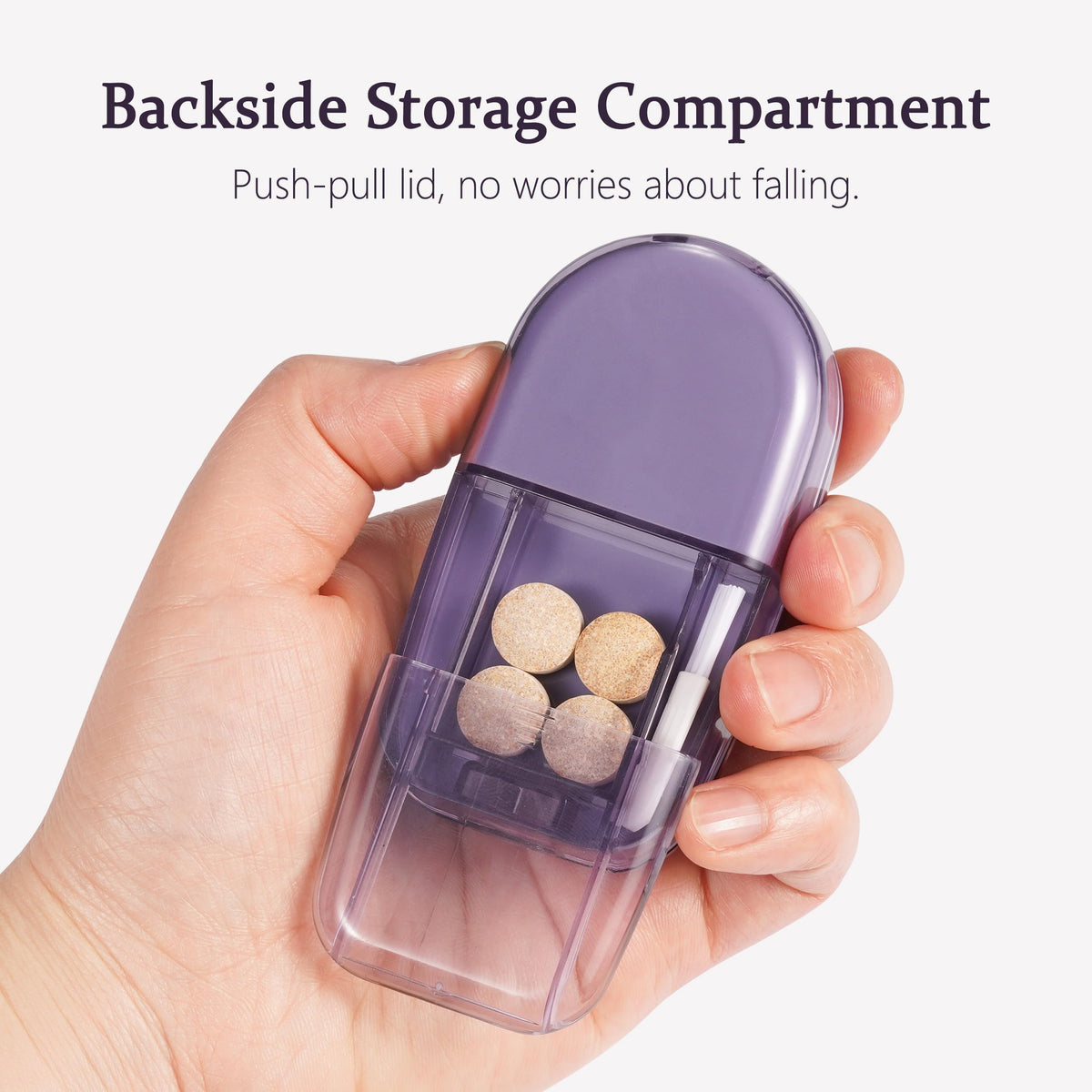 ColeMela travel pill splitter with the integrated cleaning brush detached from its slot.