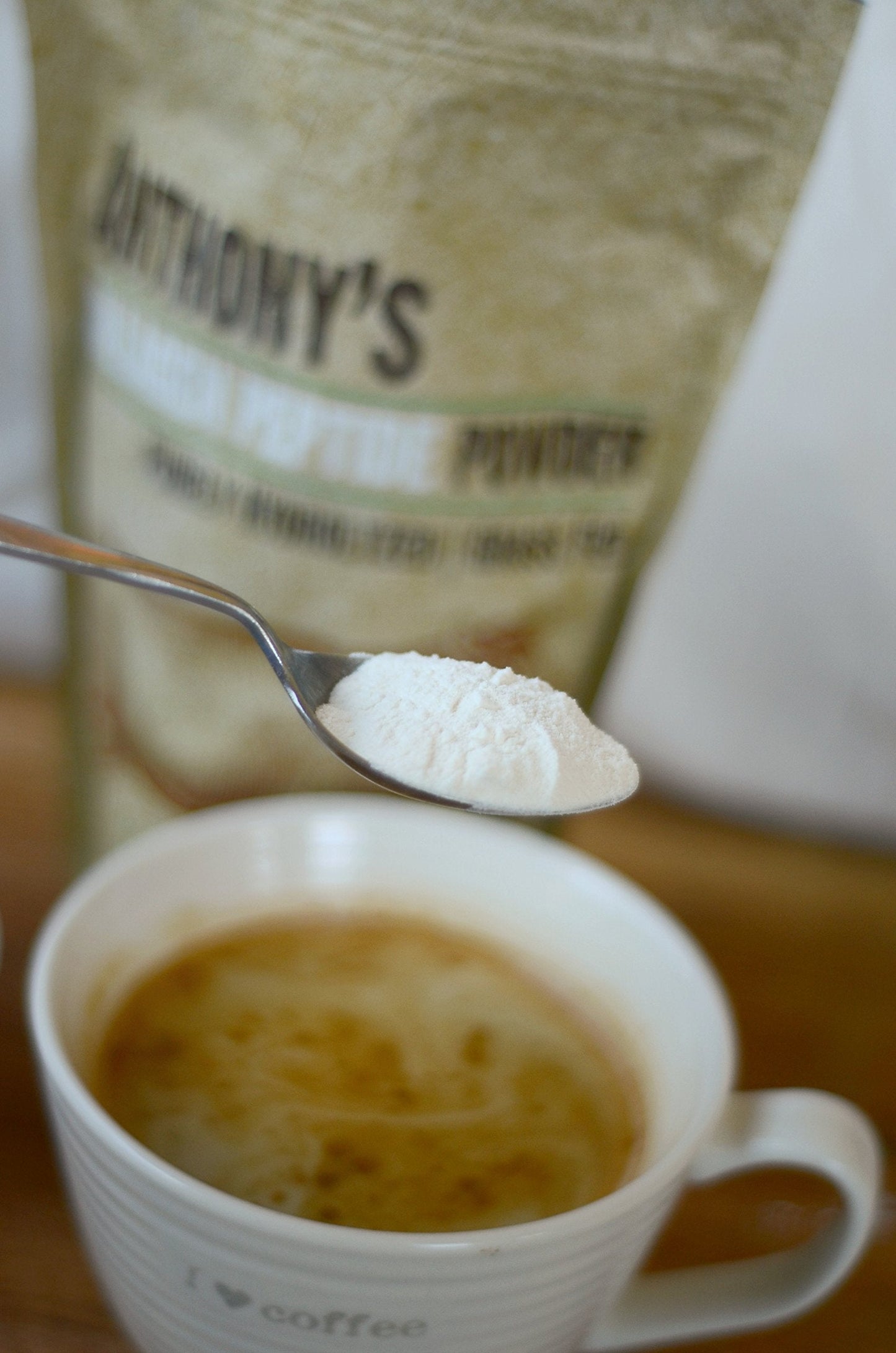 Anthony's collagen peptide supplement bag positioned next to a morning coffee mug.