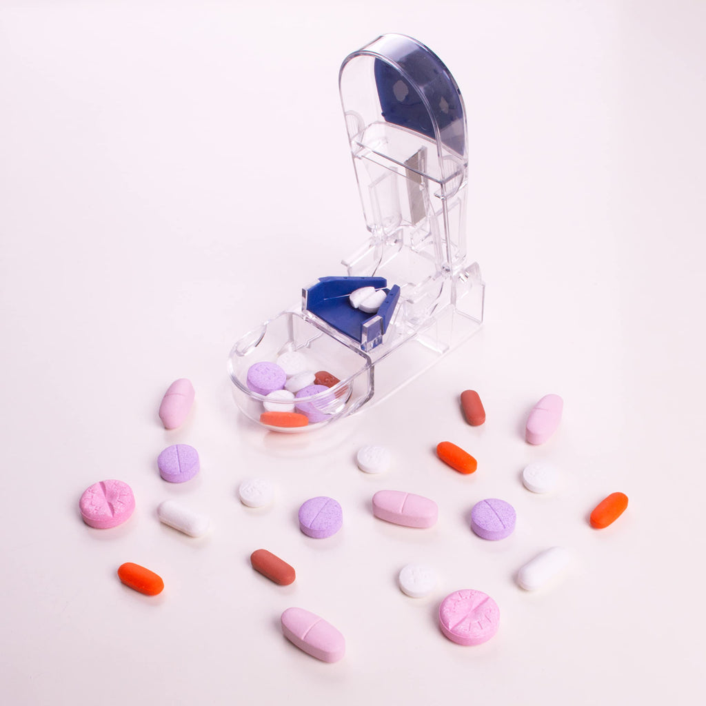 Compact medical pill splitter placed next to a travel pouch showing its portable size.