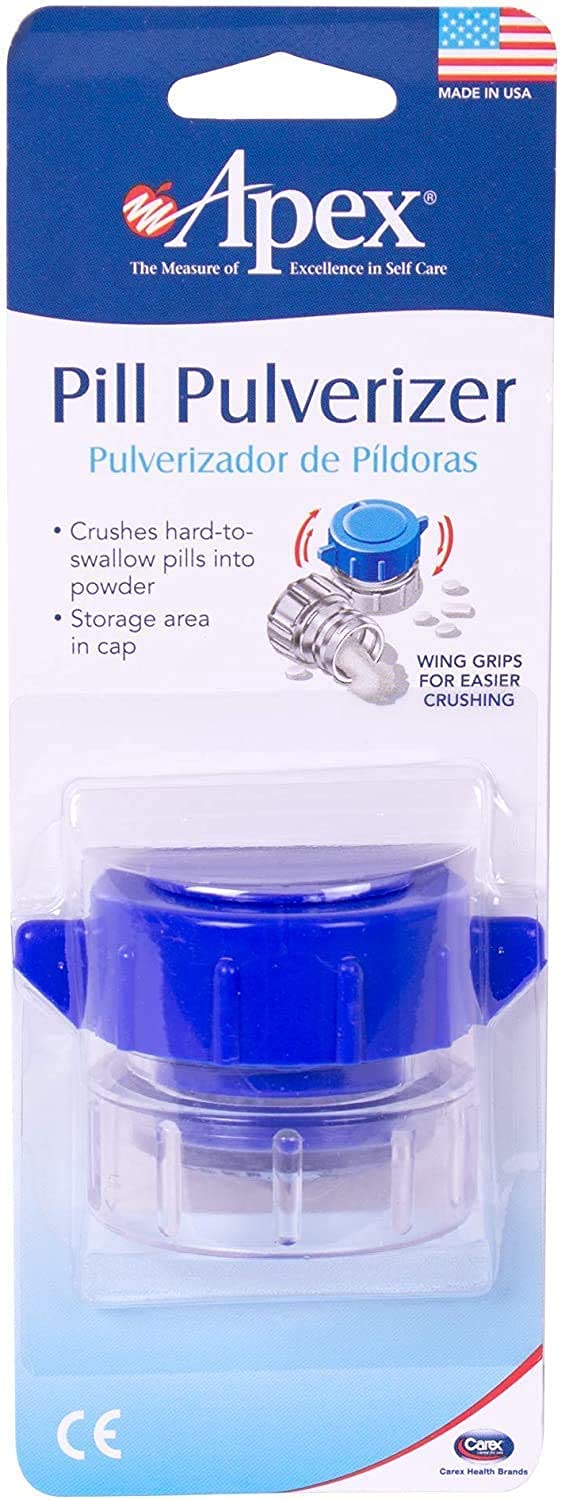 Compact portable pill pulverizer next to travel bags showing its handheld size.