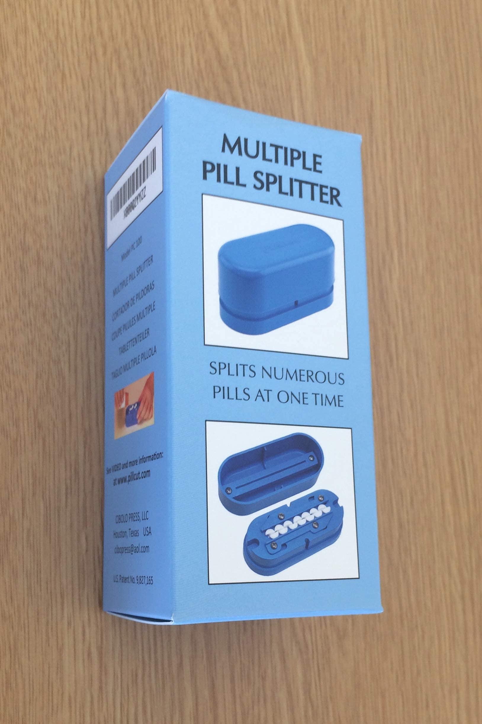 Pillcut patented tablet cutter open view displaying the spring loaded retainer bars