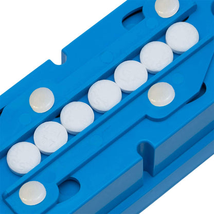 Pillcut medical tablet quarterer showing round and oblong pills secured in the tray