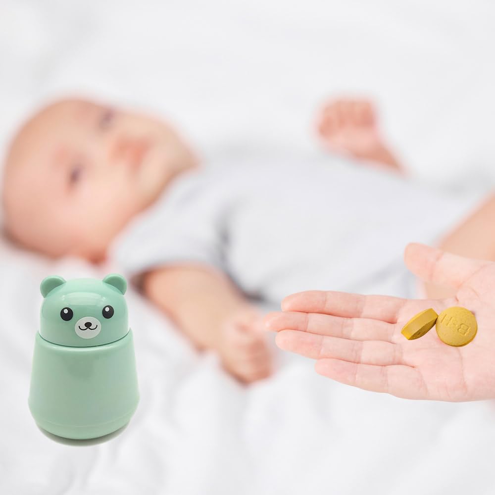 Compact green pill pulverizer being twisted by hand for easy medication management