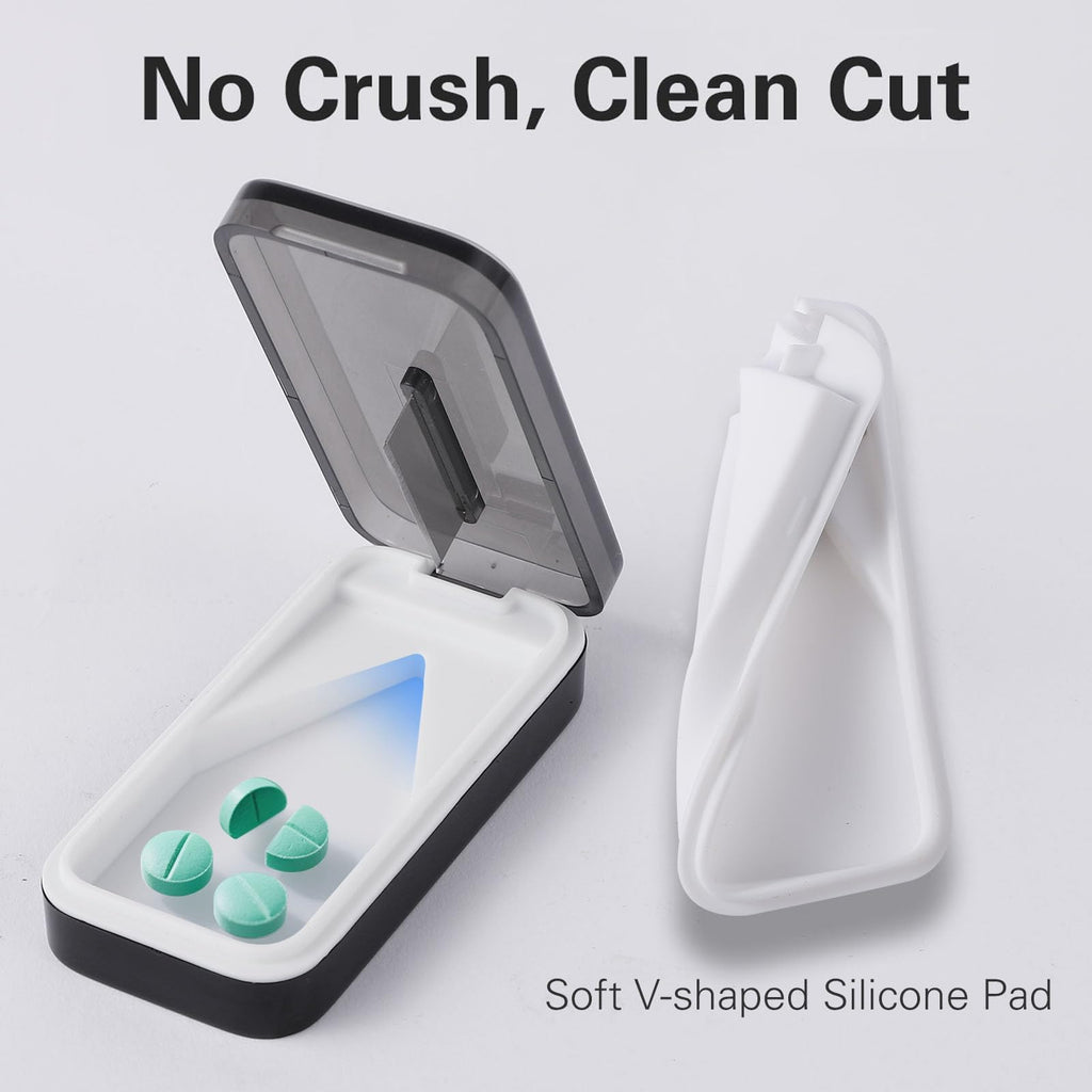 BUG HULL Tablet Splitter showing the removable V-shaped silicone pad holding a small pill.