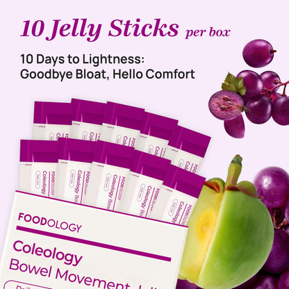 FOODOLOGY bowel movement jelly sticks arranged next to fresh grapes and prunes.