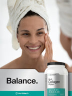 Horbäach multi collagen protein 32 ounce container placed next to a freshly blended smoothie