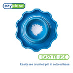 Ezy Dose healthcare utility container being twisted to grind vitamins into fine powder.