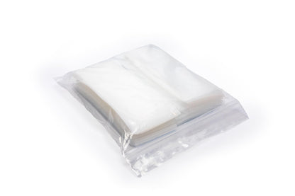 Clear plastic medication pouches containing crushed fine vitamin powder