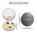 Open view of the compact travel pill organizer revealing three internal compartments and built in mirror