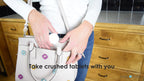 White and blue EQUADOSE tablet grinder tool showing easy grip handle for arthritis relief