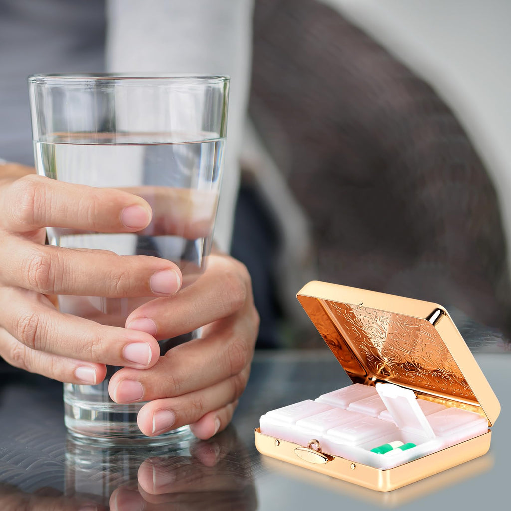 EYIWEITING pink metal pill storage container alongside daily lifestyle accessories in a handbag setting