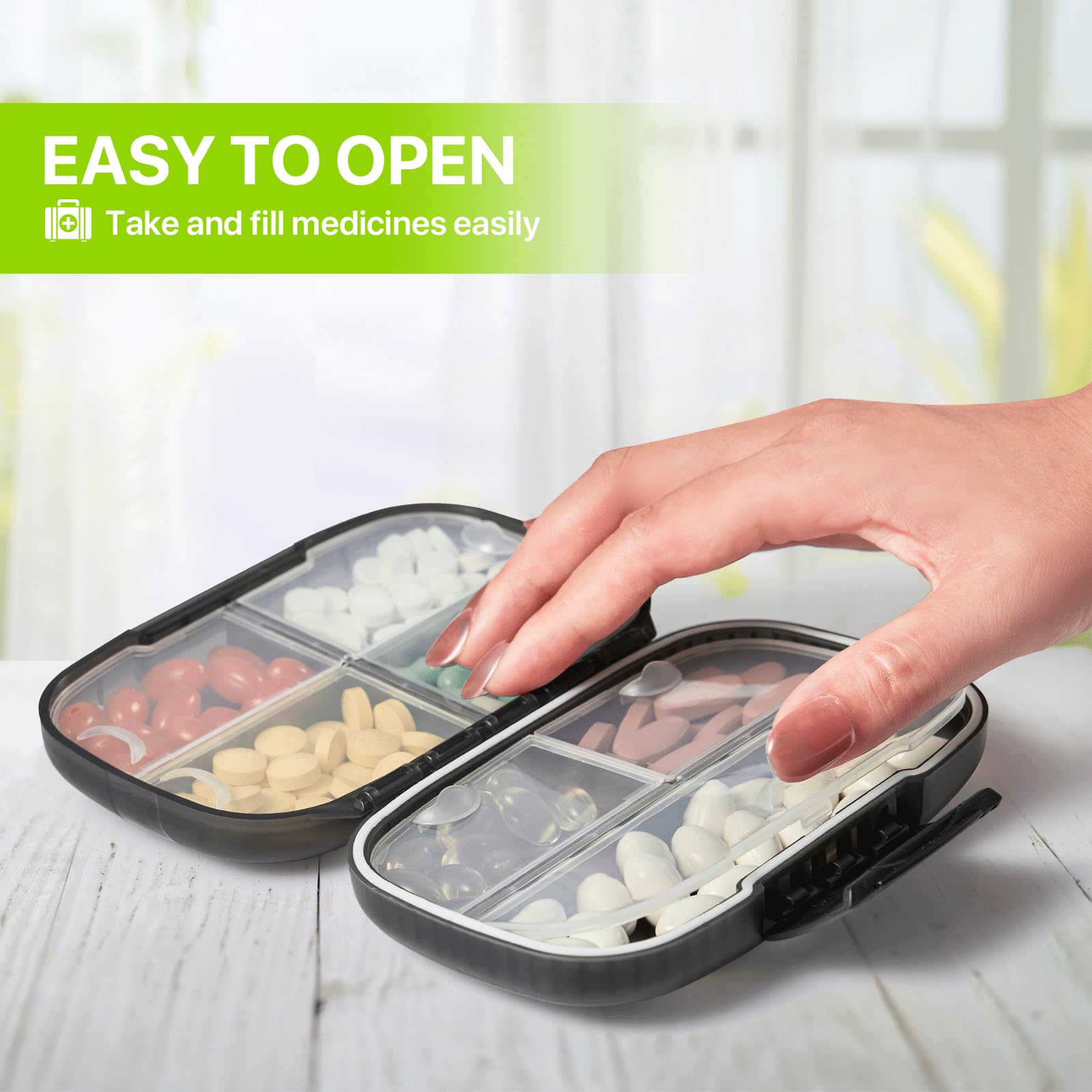 Sukuos portable medicine box open displaying seven large transparent weekly compartments filled with vitamins