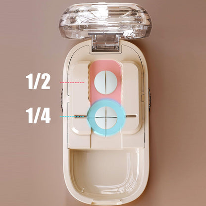 White multi pill cutter with small vitamins secured in the adjustable centering device.