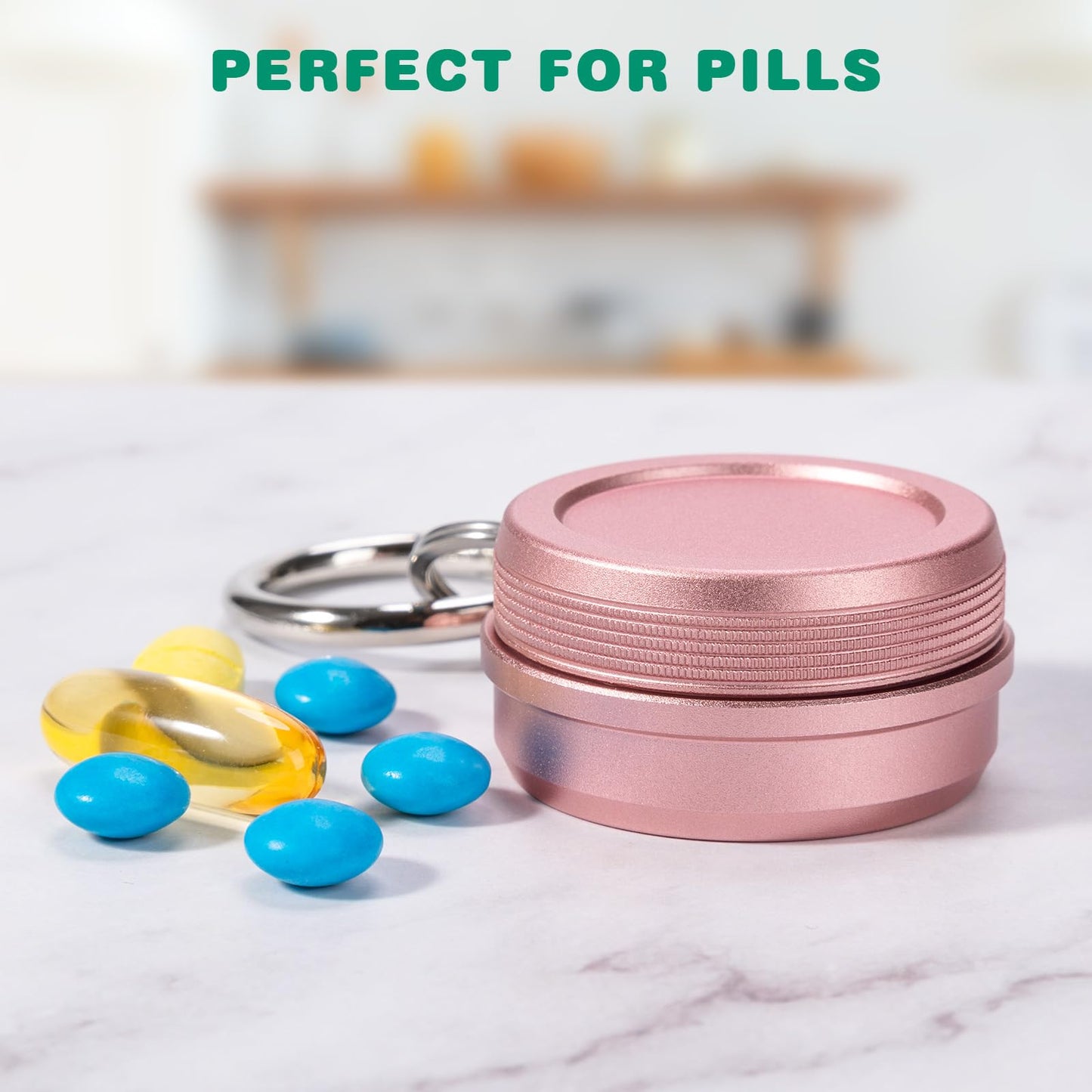 Compact aluminum alloy pill case with key ring attachment attached to backpack