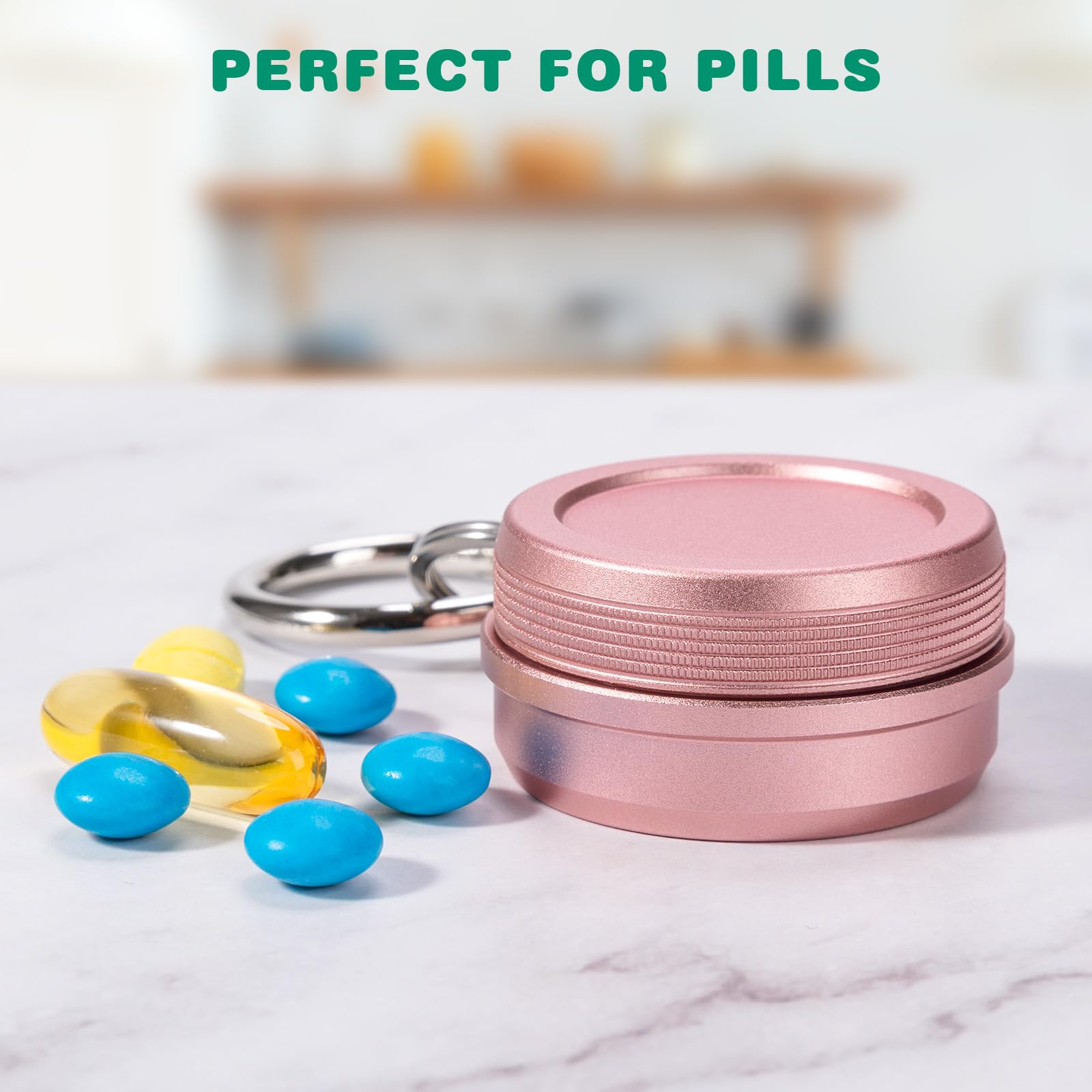 Compact aluminum alloy pill case with key ring attachment attached to backpack