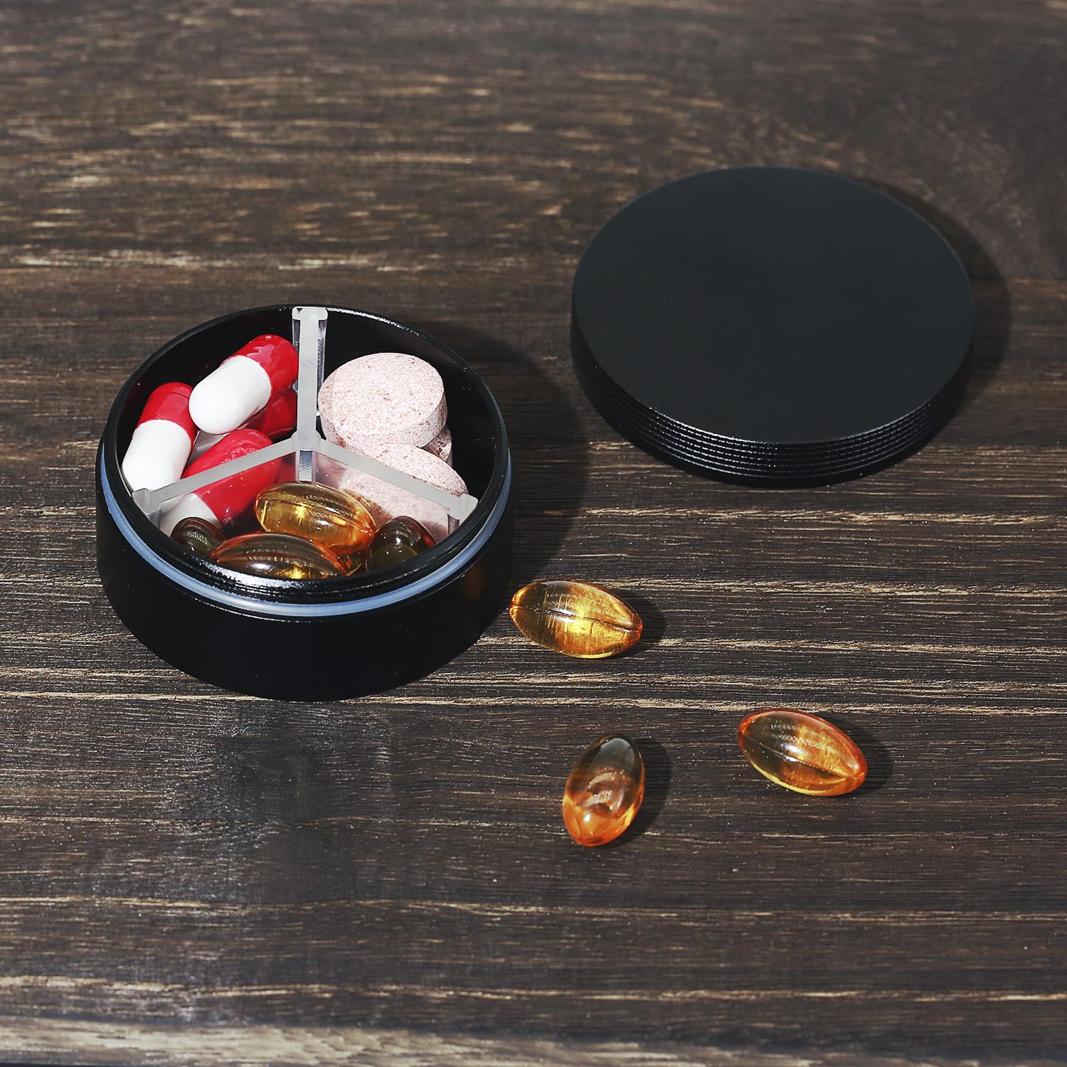 LightOnIt everyday carry vitamin container with the internal plastic divider removed for single compartment use