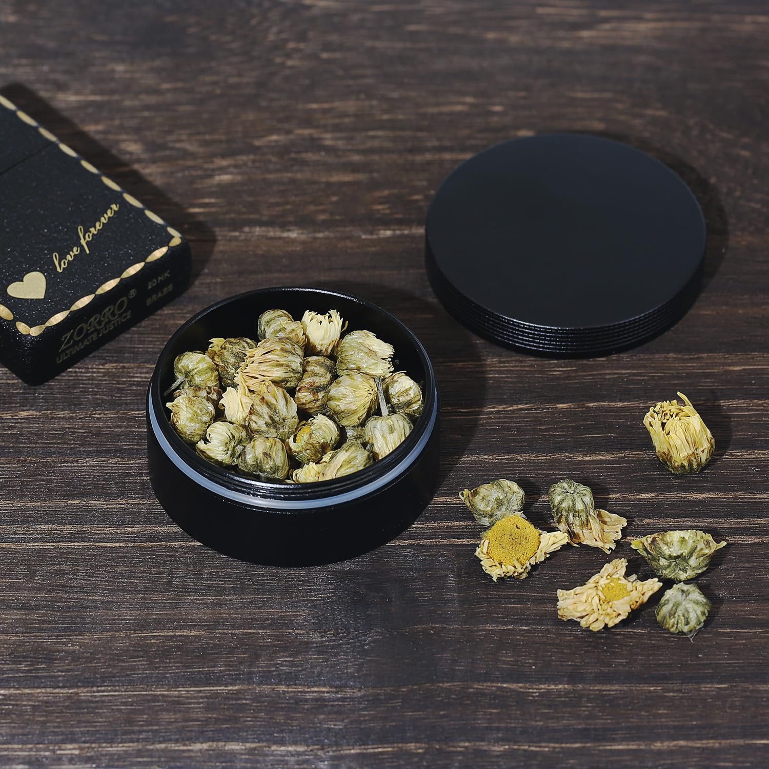 Durable metal round pill case being held in hand showing its pocket-sized ergonomic design
