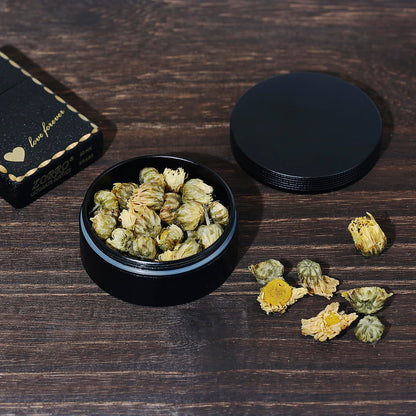 Durable metal round pill case being held in hand showing its pocket-sized ergonomic design