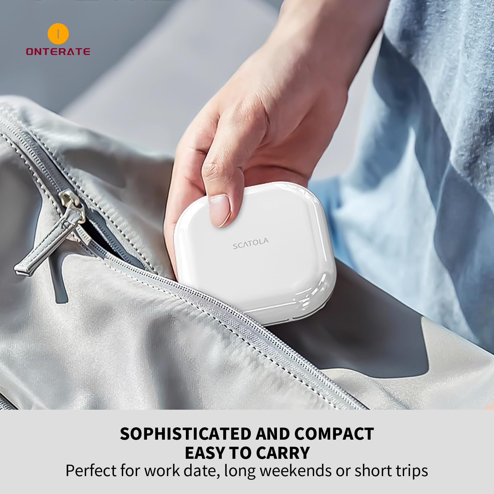 Onterate black travel pill case being placed inside a small purse