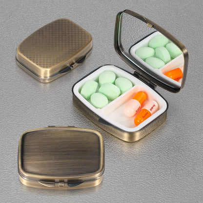 Dynippy portable vitamin organizer with the middle divider removed showing single compartment storage capacity.