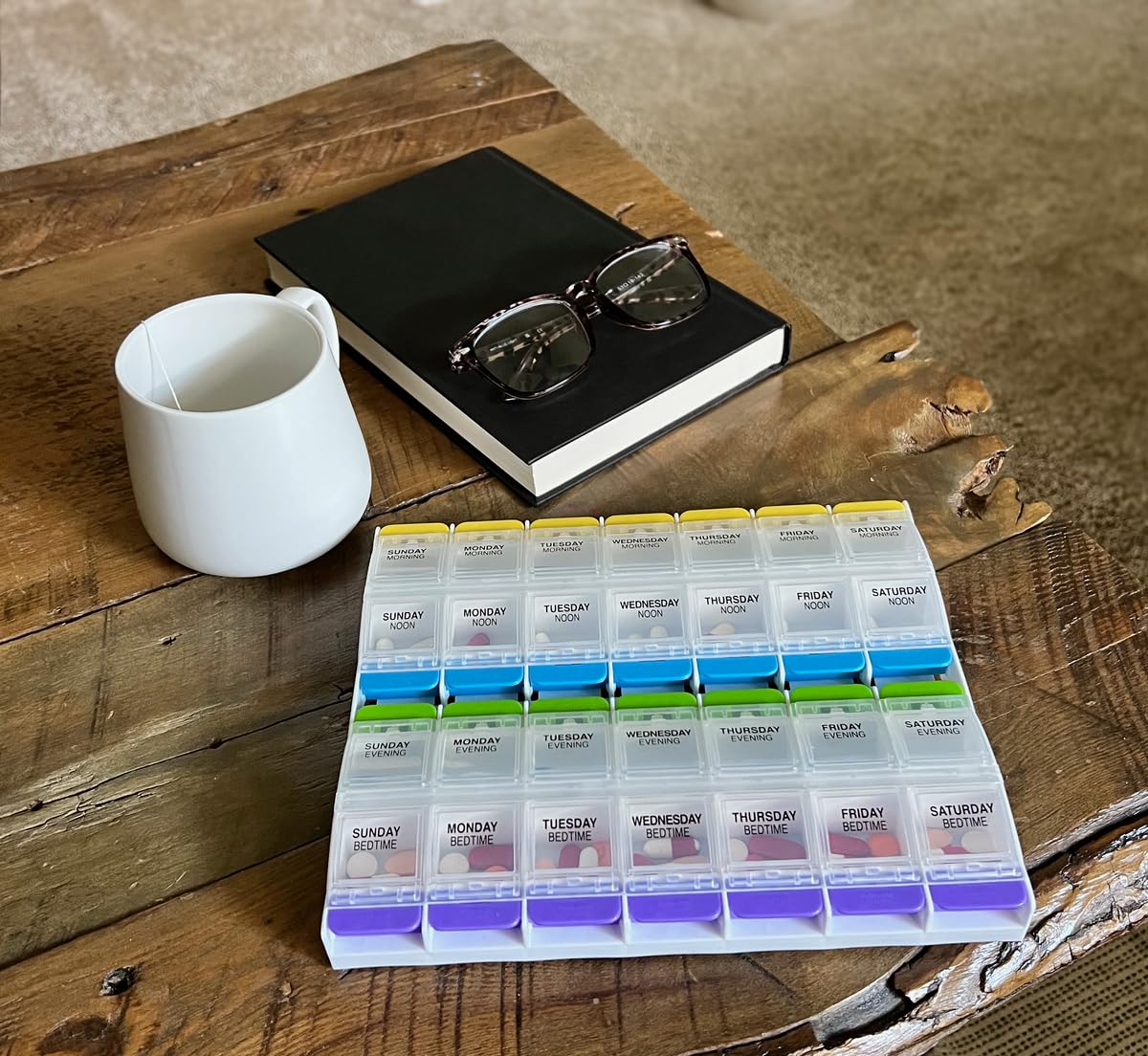 Ezy Dose arthritis friendly pill box showing the one-touch button operation closely