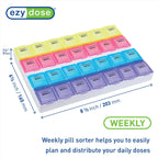 Close-up view of the contoured compartments on the EZY DOSE medicine planner for easy pill retrieval.