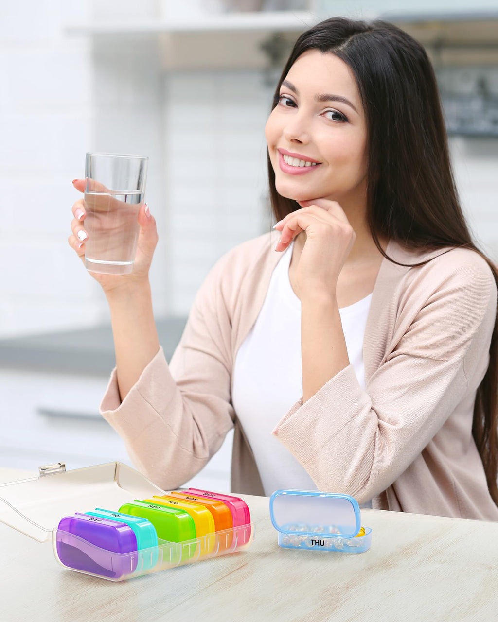 Top angle view of the BPA free food grade plastic ZIKEE weekly pill case arranged in vivid rainbow visual organization colors