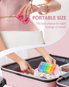 FEATY daily vitamin planner held in hand to demonstrate its portable size for travel use.
