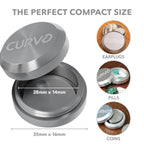 Sleek CURVD keychain container attached to a travel backpack for easy everyday access