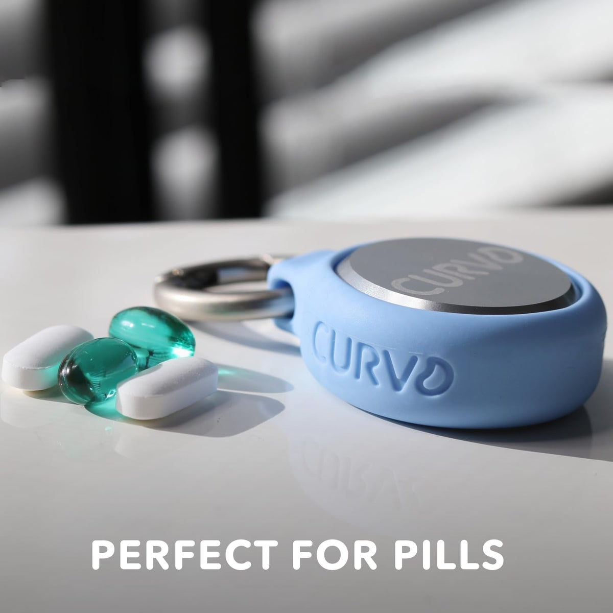 Premium aircraft grade aluminum travel container next to daily vitamins and jewelry items