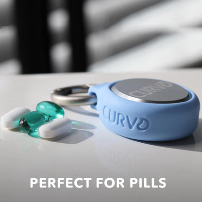 Premium aircraft grade aluminum travel container next to daily vitamins and jewelry items