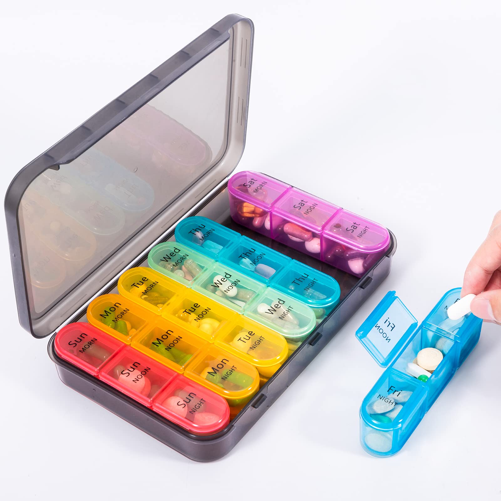 Elderly user opening the easy to operate snap lids of the twenty one compartment box.