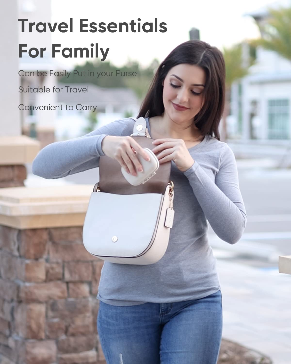 Holii pocket size capsule dispenser being placed inside a travel purse