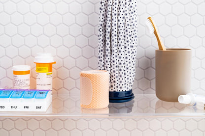 Ezy Dose small pop out pill organizer showing Braille markings on lids