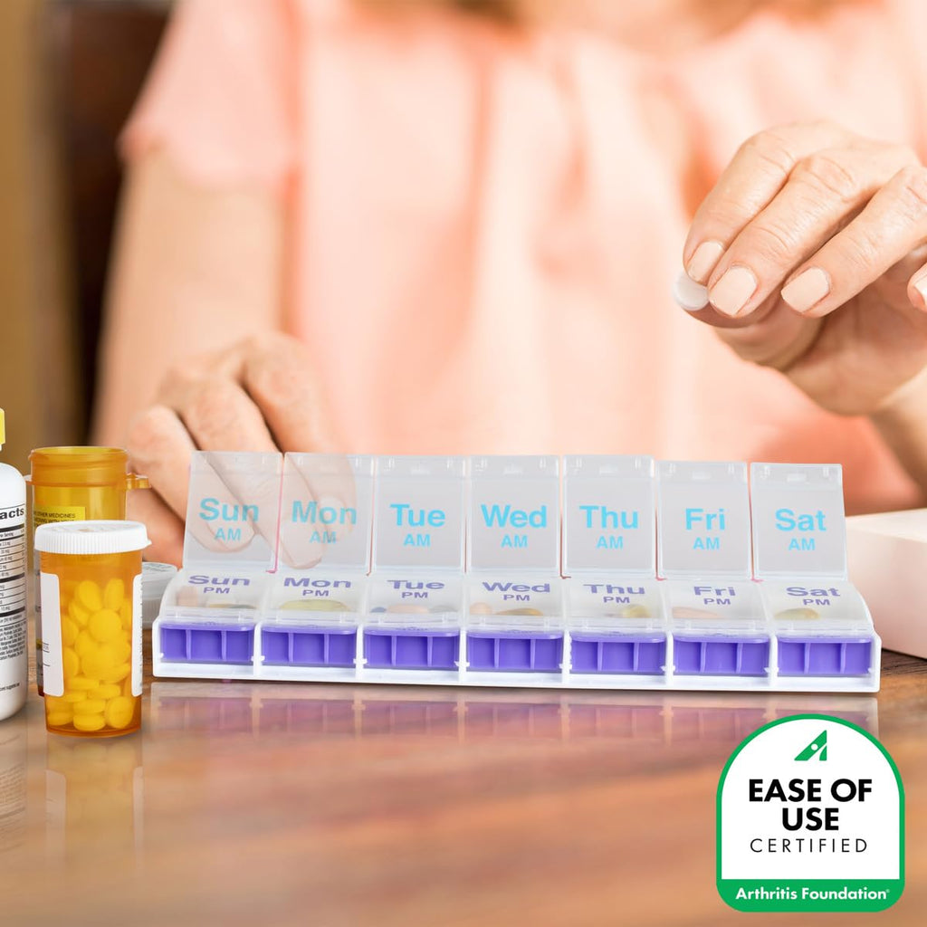 EZY DOSE Push Button Medicine Box resting on a counter showing the secure non-skid base feature.