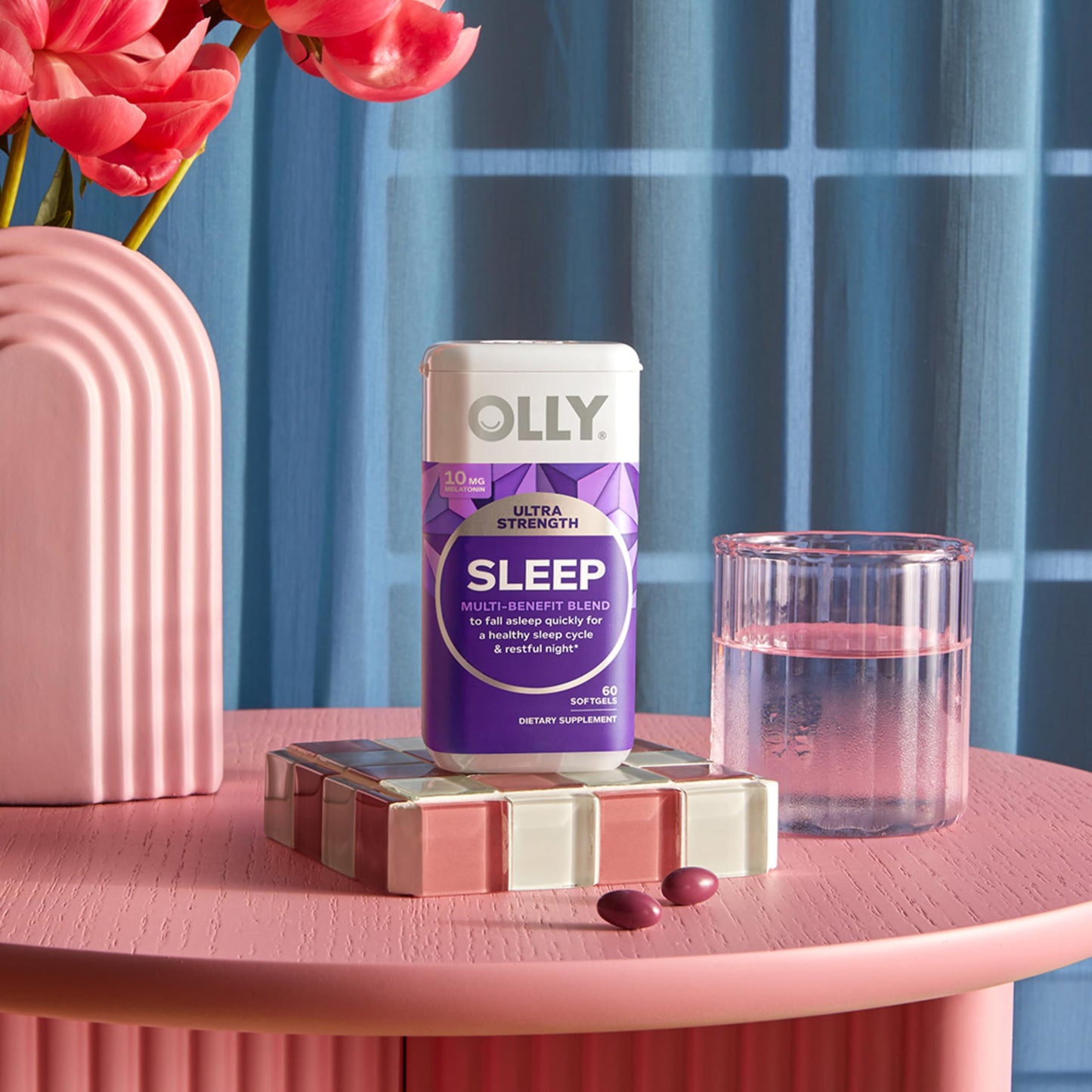 Authentic OLLY 10mg melatonin nighttime sleep aid container on display