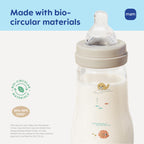 MAM premium glass wide neck bottle being held to display the ergonomic shape for parents.