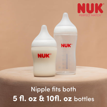 Side angle of NUK Perfect Match slow flow bottle showing ergonomic grip shape