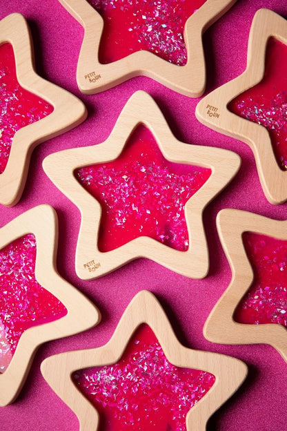 Handmade Petit Boum wooden sensory star in pink